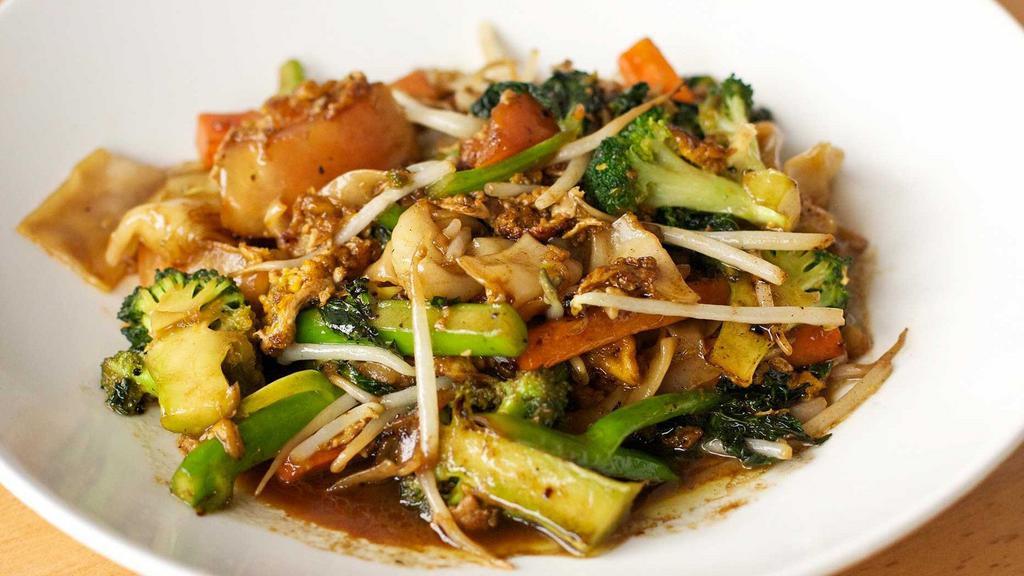Pad See Ew · Stir-fry thick rice noodles with Chinese broccoli, carrots, tomatoes, and bean sprouts served with a sweet soy sauce,