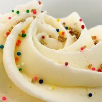 Vanilla/Vanilla Cupcake · Vanilla cupcake topped with vanilla buttercream and seasonal sprinkles.