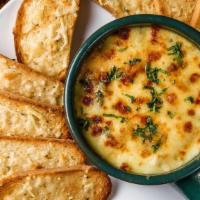 Crab & Artichoke Dip · Artichoke Hearts, Parmesan-Swiss Cheese Blend, Grilled Bread