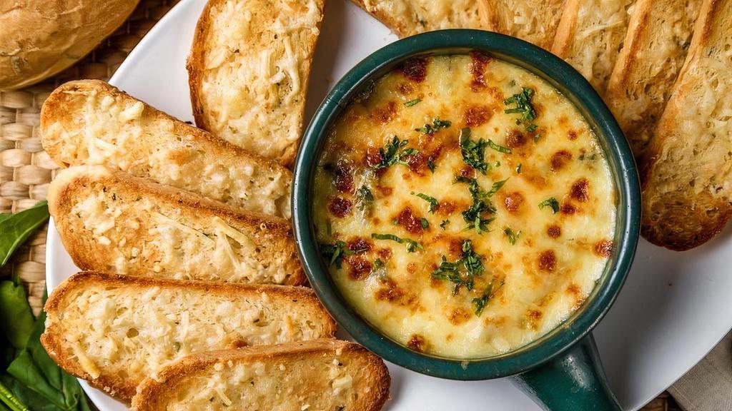 Crab & Artichoke Dip · Artichoke Hearts, Parmesan-Swiss Cheese Blend, Grilled Bread