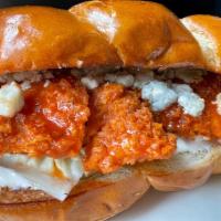 America'S Best Chicken Sandwich · Crispy Fried Chicken Breast, Lettuce, Tomato, Onions, Blue Cheese Crumbles, tossed in our si...