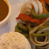 Bistec Merengue · Thin Cut Marinated Steak Sauteed with Peppers and Onions