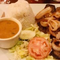 Bistec Encebollado · Thin Cut Marinated Steak Topped with Onions