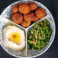 Falafel · Fried chickpeas, garlic, onion and spices. Served with tabbouleh, hummus, and pita bread.