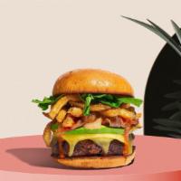 Everything Must Go Burger · Seasoned Beyond Meat patty perfectly cooked, topped with french fries, melted vegan cheddar ...