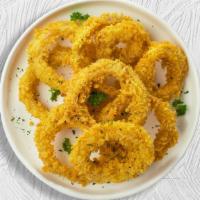 Lucky Onion Rings · Sliced onions dipped in a light batter and fried until crispy and golden brown.