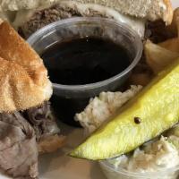 Classic French Dip · Thin sliced roast beef with melted provolone, on a garlic Kaiser roll with a side of au jus.
