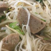 Pho Tai Chin · Beef noodle soup with eye round steak and well-done brisket. All bowls are served with choic...