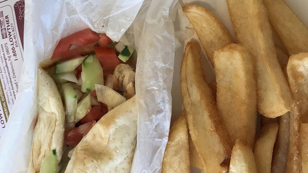 Chicken Souvlaki · Grilled chicken with diced tomato, cucumbers, onions and parsley wrapped in a pita with tzatziki sauce.
