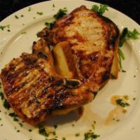 Pork Chops · Two thick cut chops broiled and served on toast with apple sauce.