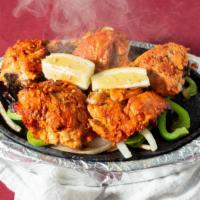 Tandoori Chicken
 · Fresh spring chicken marinated in north indian style in red spice in red spice and cooked in...