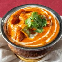 Chicken Tikka Masala

 · Boneless chicken cooked in a thick creamy sauce with nuts.