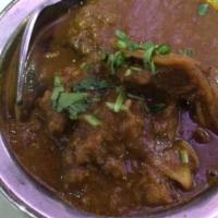 Goat Curry
 · Tender meat of goat cooked with onion tomato and authentic sauce and fine with cilantro.