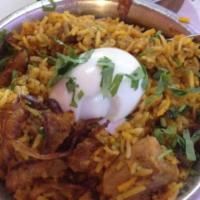 Hyderabadi Chicken Dum Biryani
 · Classic Mughal dish of curried chicken in rice with boiled egg served with raita.