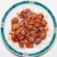Honey Glazed Sesame Chicken · Crunchy chicken tossed with a honey sauce and sprinkled with sesame seeds.