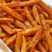 Seasoned Fries  · Coated French cut seasoned potatoes deep fried to golden perfection served with tomato ketchup