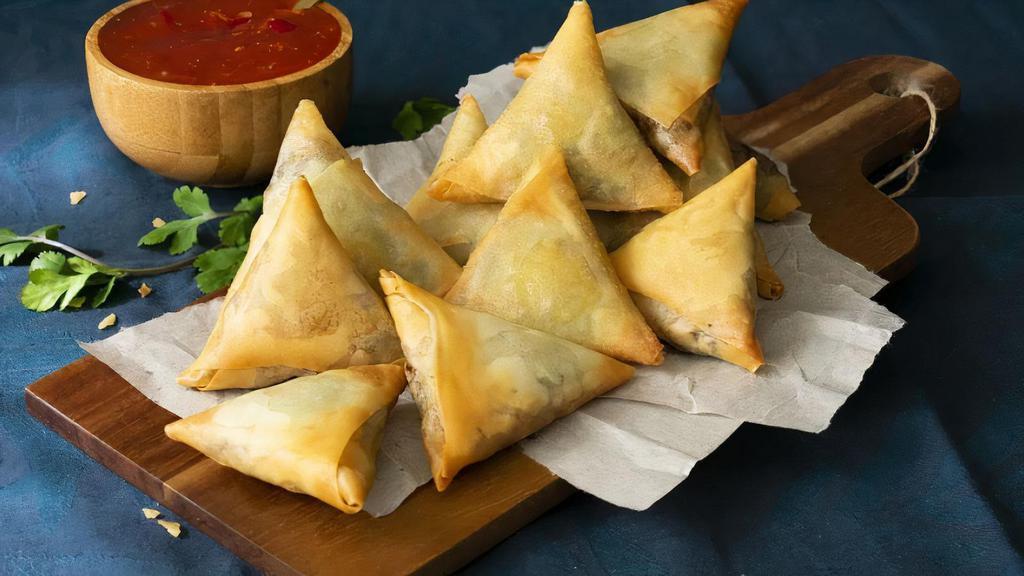 Veggie Samosa (3 Pieces) · Vegetarian. Fritter filled with seasoned potatoes and peas.