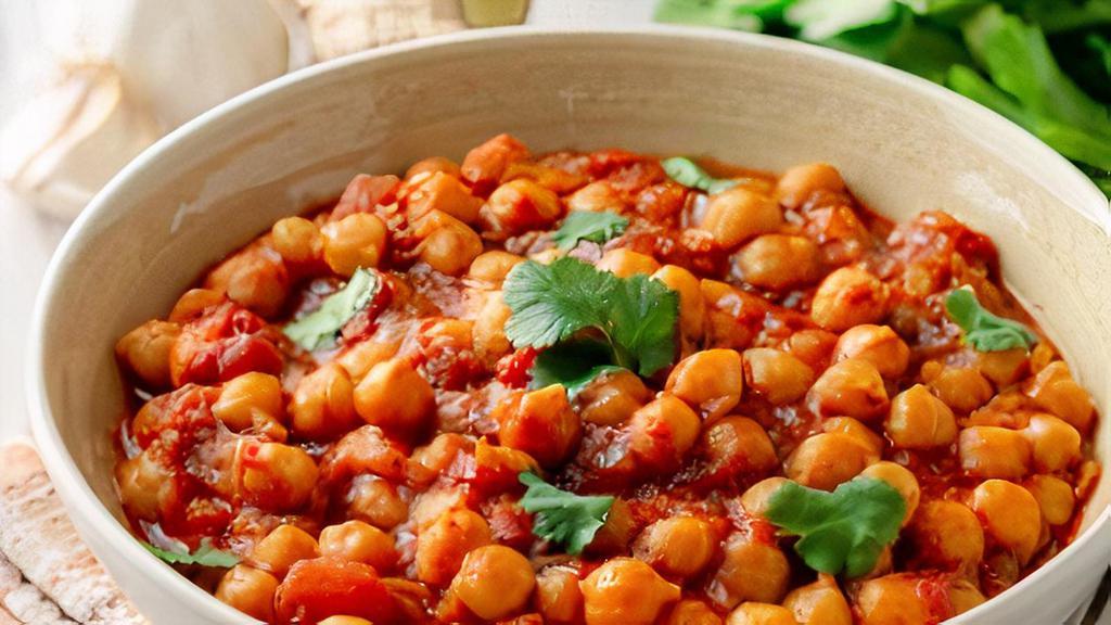 Chana Masala · Vegetarian. Chickpeas cooked with chilies, onions, garlic cilantro, and a blend of spices.