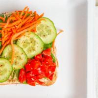 Veggie Hummus Toast · Hummus topped with spinach, carrots, cucumber and roasted red pepper.