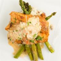 Bronze Salmon · Pan seared Salmon topped with Cajun Cream Sauce 1pc Shrimp served with creamy mash and sauté...