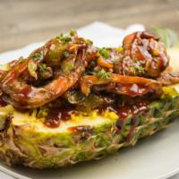 Jerk Barbecue Shrimp · Grilled Barbecue Shrimp topped with jerk sauce Mixed with onions and peppers laid over yello...