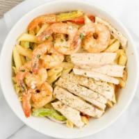 Rasta Pasta · Creamy Penne Pasta tossed with Caribbean Style Jerk Chicken, Shrimp and sautéed Bell peppers...