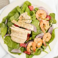 Cray Salad · Served with Grilled Chicken and Shrimp on bed of spinach top red onion mixed berries, croton...