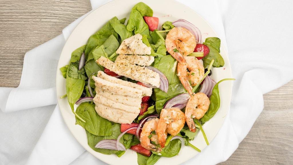 Cray Salad · Served with Grilled Chicken and Shrimp on bed of spinach top red onion mixed berries, crotons and a side lemon vinaigrette