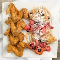 Chicken & Waffle · Topped with mixed berries, caramel glaze, and powdered sugar. Choose between Red Velvet waff...