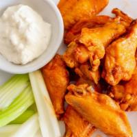 Buffalo Wings · Served with bleu cheese and celery by the dozen (12).