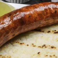 Sausage · Served with arepa (corn cakes).