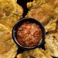Patacon Con Hogao · Deep fried plantain topped with Colombian style salsa