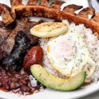 Bandeja Paisa · Typical Colombian dish. With rice, pork belly, egg, sausage, fried banana, beans, and steak.