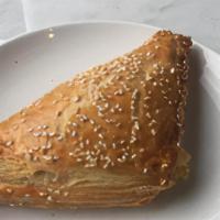 Cheese Boureka · Flaky puff pastry dough filled with a ricotta and feta cheese. Topped with sesame seeds.. Co...