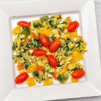 Veggie Omelet · Eggs, onion, spinach, paper and tomatoes served with white or wheat bread.