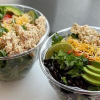 Southwest Salad · Black bean corn salsa, avocado, cilantro, lime, cheese, homemade southwest dressing