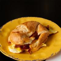 Breakfast Sandwiches · Two scrambled eggs, cheddar cheese, and your choice of meat (bacon, sausage, or turkey sausa...