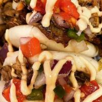 Steak And Cheese · Shaved steak and American cheese peppers and onions