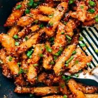Honey Chili Garlic Fries · Extra crunchy fries tossed with honey and chili garlic sauce.