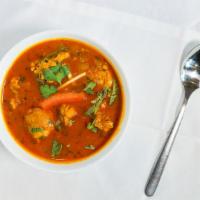 Chicken Curry · Light gravy made with onions and tomatoes, flavored with ginger, and garlic.