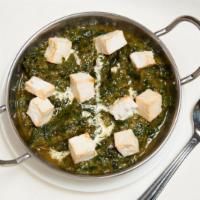 Saag Paneer · Fresh soft Indian Cottage cheese cubes cooked with spinach purée, onion, ginger, herbs, and ...