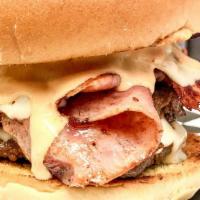 Cordon Blue Steak Burger · Includes mounds of ham, Swiss and Thousand Island dressing. Special blend of chuck steak, si...