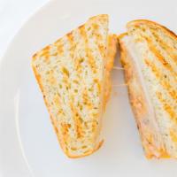 Turkey & Pepper Jack Panini · Turkey, pepper jack cheese, red onions (temporarily out), tomato, bell pepper rings, chipotl...