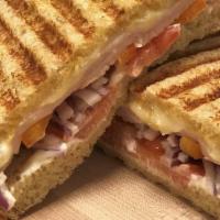 Turkey & Swiss Panini · Turkey, swiss cheese, tomato, red onion (temporarily out), bell pepper rings, dijon mustard,...