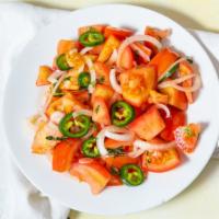 Tomato Salad · {Kachumbari} Tomatoes chopped with onions, green chili, parsley and a lemon oil house dressi...
