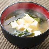 Miso Soup · Miso paste and dashi based broth. Seaweed, tofu and scallion.