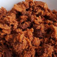 Siga Firfir · meat sauce mixed with pieces of injera.