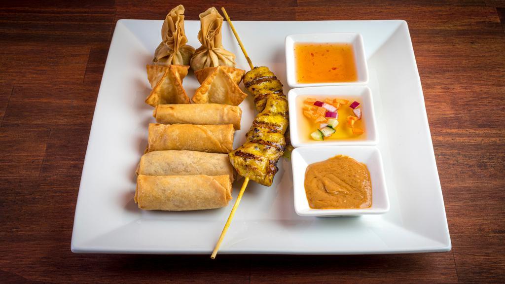 Siam Sampler · 2 chicken satay, 2 chicken spring roll, 2 crab Rangoon, 2 veggie crispy rolls and 2 golden bags. Served with peanut sauce and sweet chili sauce.