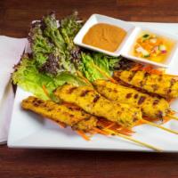 4 Piece Chicken Satay · Grilled chicken skewers marinated in Thai spices and coconut milk. Served with house peanut ...