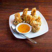 6 Piece Golden Bag · Crispy wonton bag stuffed with vegetables. Served with sweet chili sauce. Vegetarian.